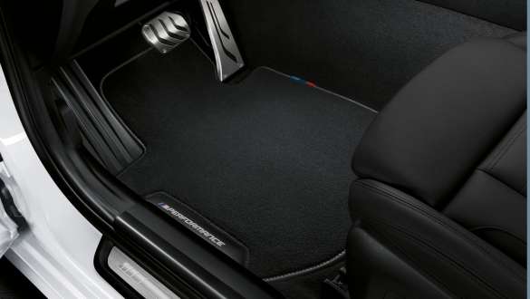 BMW 3 Series Sedan, M Performance floor mats. Close-up view of the BMW 3 Series Sedan with focus on the BMW M Performance floor mats.
