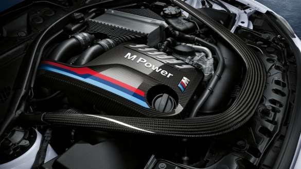 BMW 3 Series Sedan, M Performance engine cover. Close-up view of the BMW 3 Series Sedan with focus on the BMW M Performance engine cover carbon fibre.
