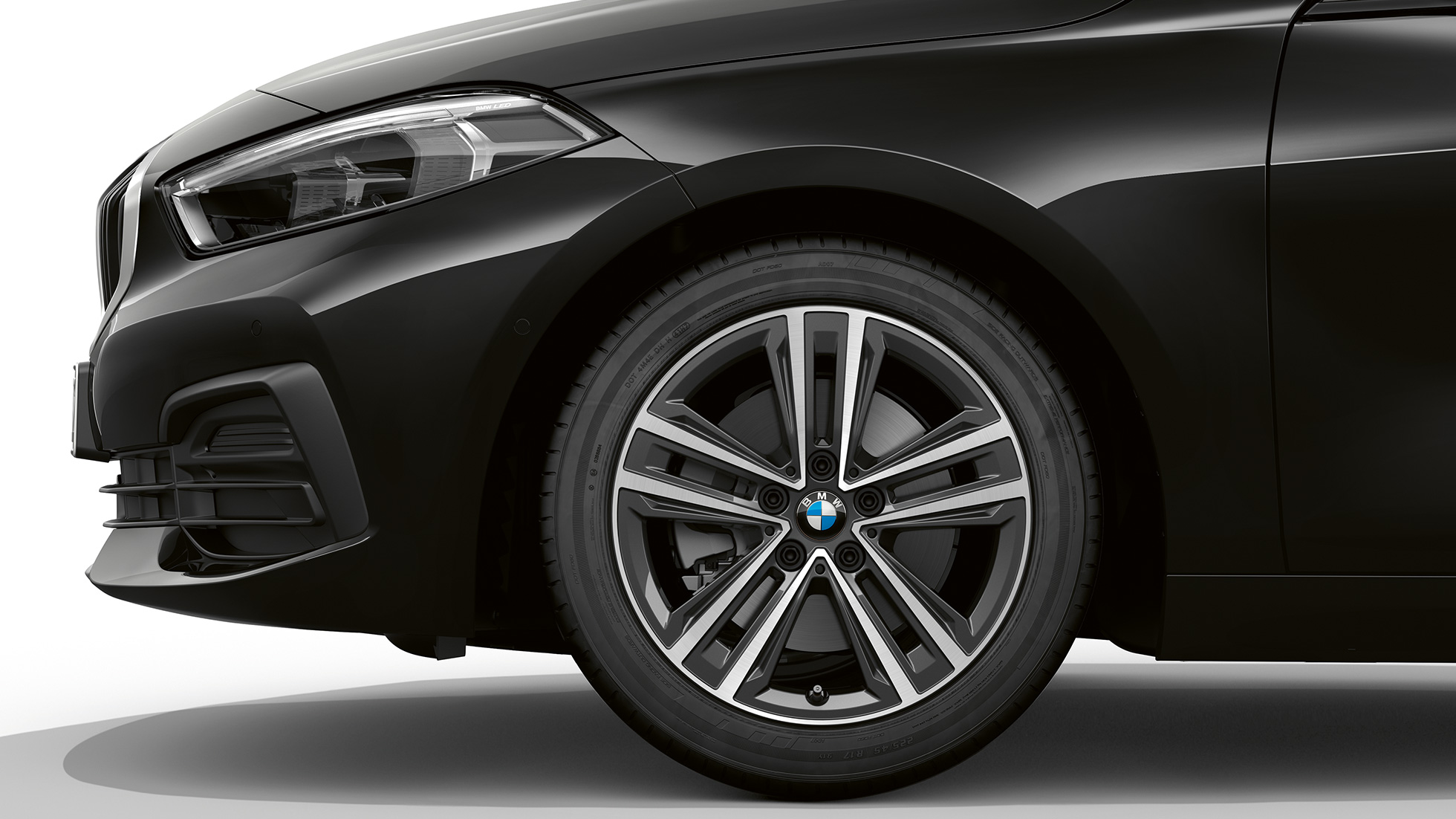 16" light-alloy wheel Star-spoke 517 style. BMW 1 Series Model Advantage in Black, side view of front with 16" light-alloy wheel Star-spoke 517 style.