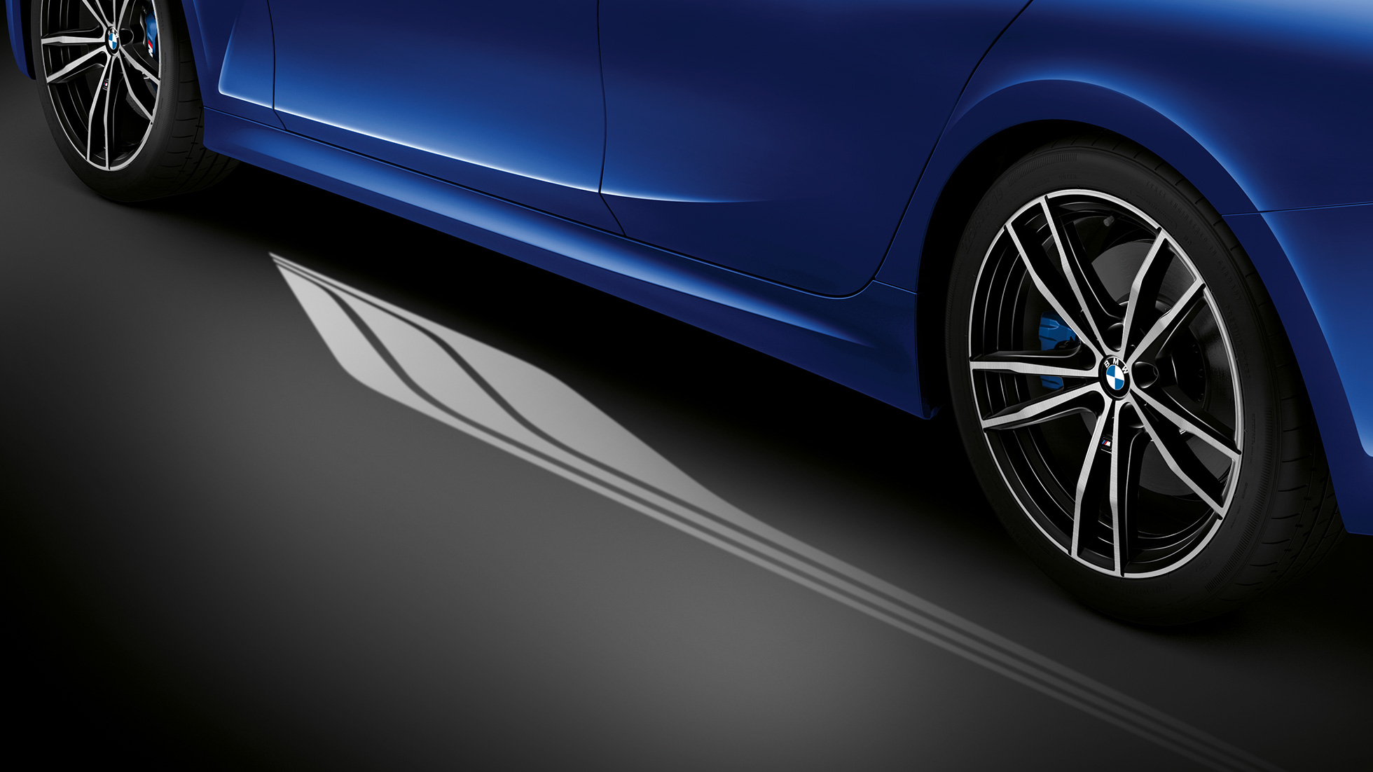 BMW 3 Series Sedan, Welcome Light Carpet Detailed side view of the open driver's door with Welcome Light Carpet.