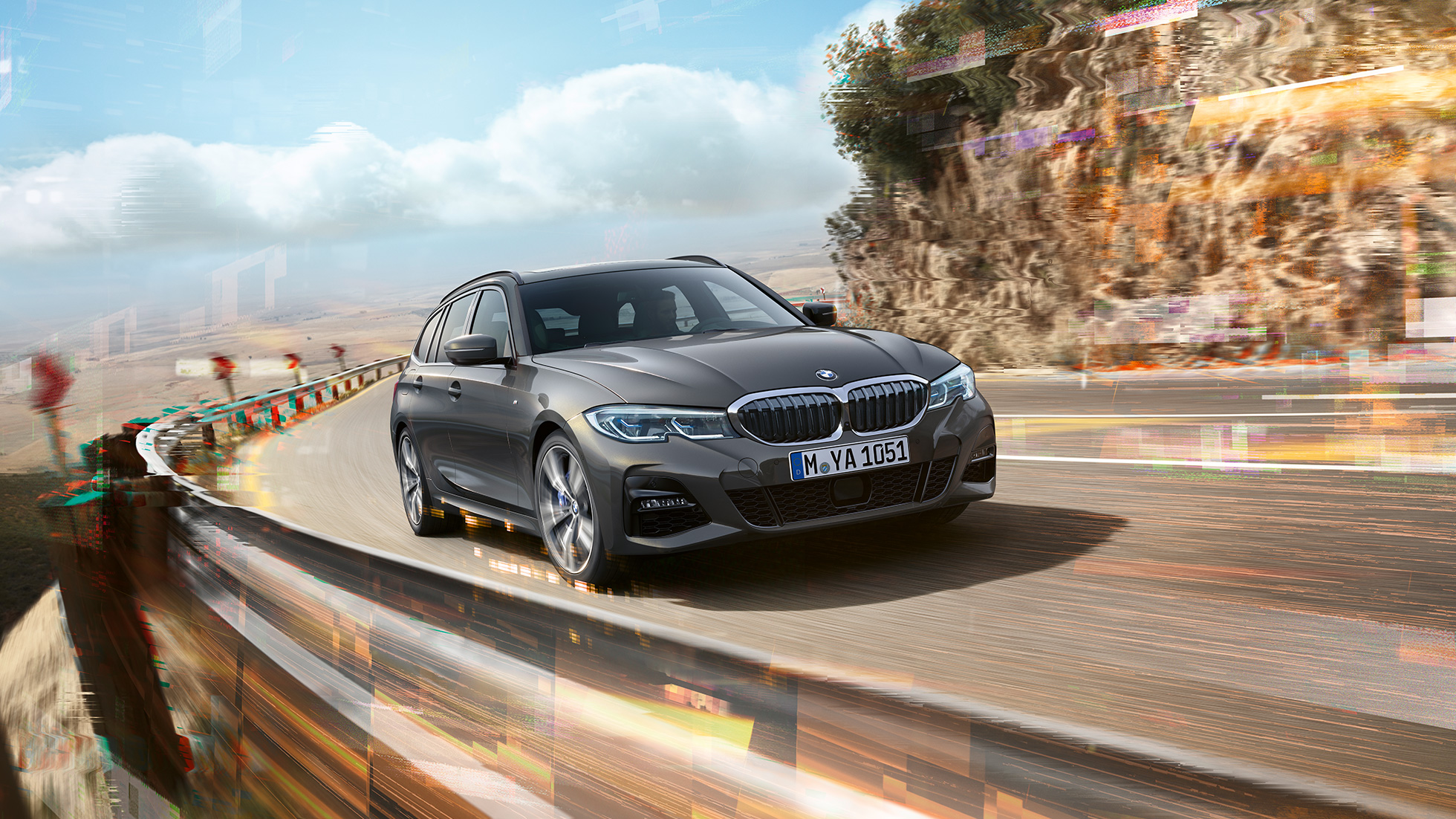 BMW 3 Series Touring, three-quarter front shot design BMW 3 Series Touring, three-quarter front shot driving on bridge in front of rural surroundings