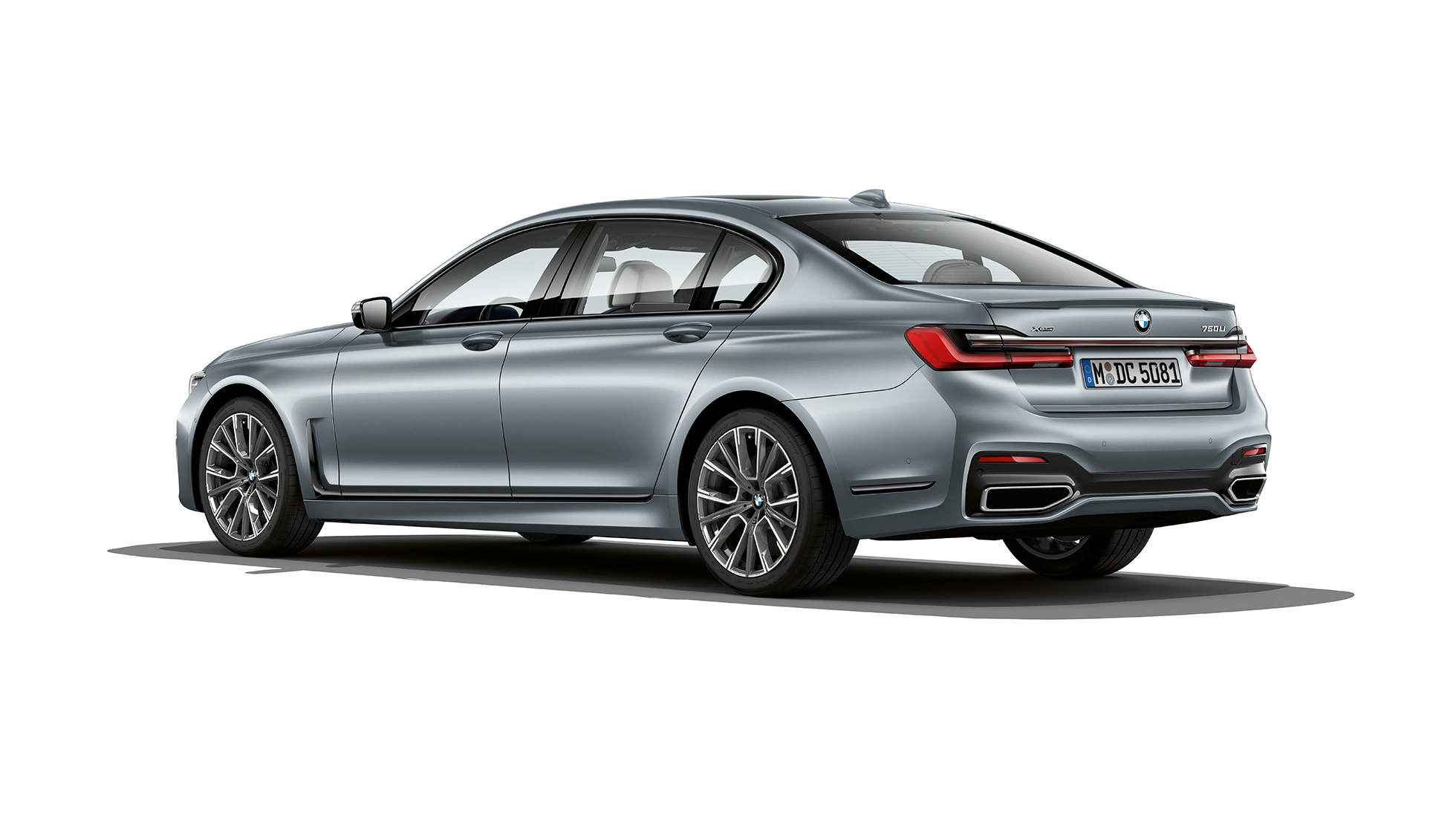 BMW 7 Series Sedan M Sport package, three-quarter rear view Grey BMW 7 Series Sedan M Sport package in three-quarter rear view