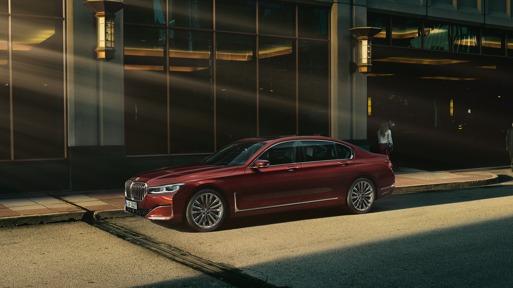 BMW Individual 7 Series Sedan, side view BMW Individual 7 Series Sedan in red in side view in front of urban setting