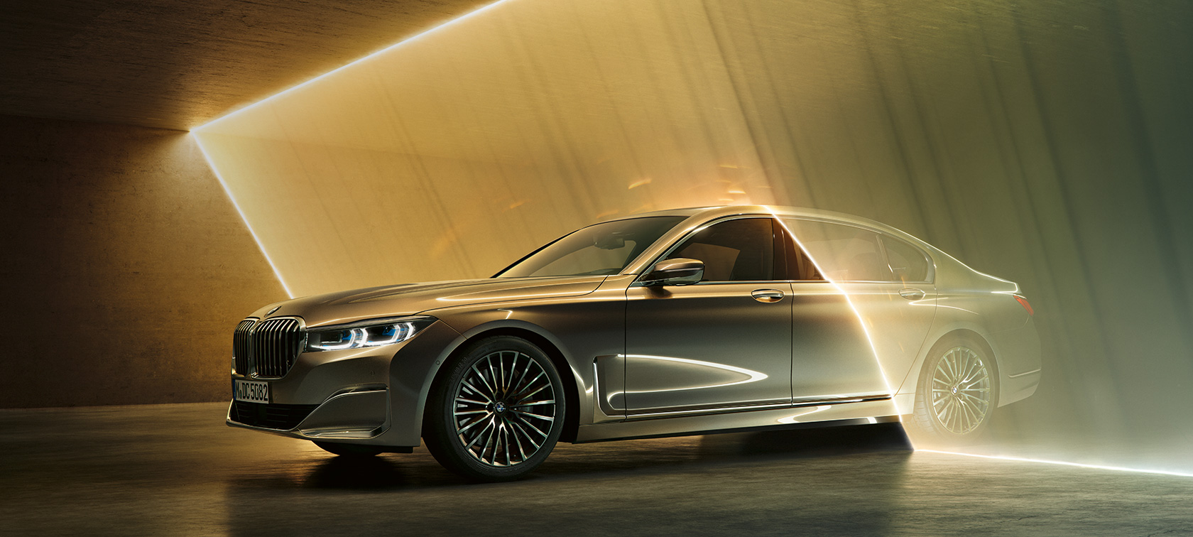 BMW 7 Series Sedan in three-quarter front view BMW 7 Series Sedan: grey BMW in three-quarter front view surrounded by beams of light