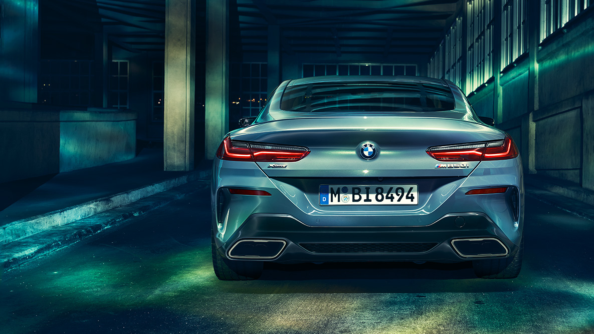 BMW 8 Series Coupé, rear view. Rear view of the BMW 8 Series Coupé at night in an urban setting.