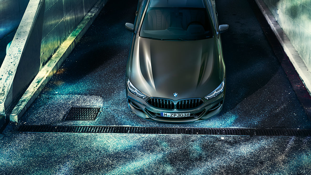 Front still shot of the BMW 8 Series Coupé. Front still shot of the BMW 8 Series Coupé with BMW Individual equipment in an urban setting at night.