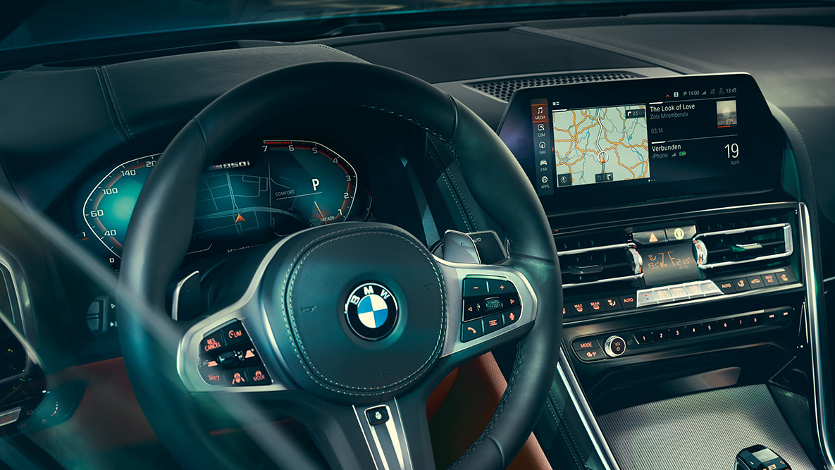 BMW 8 Series Coupé, cockpit. Close-up of the BMW 8 Series Coupé interior with a focus on the steering wheel.