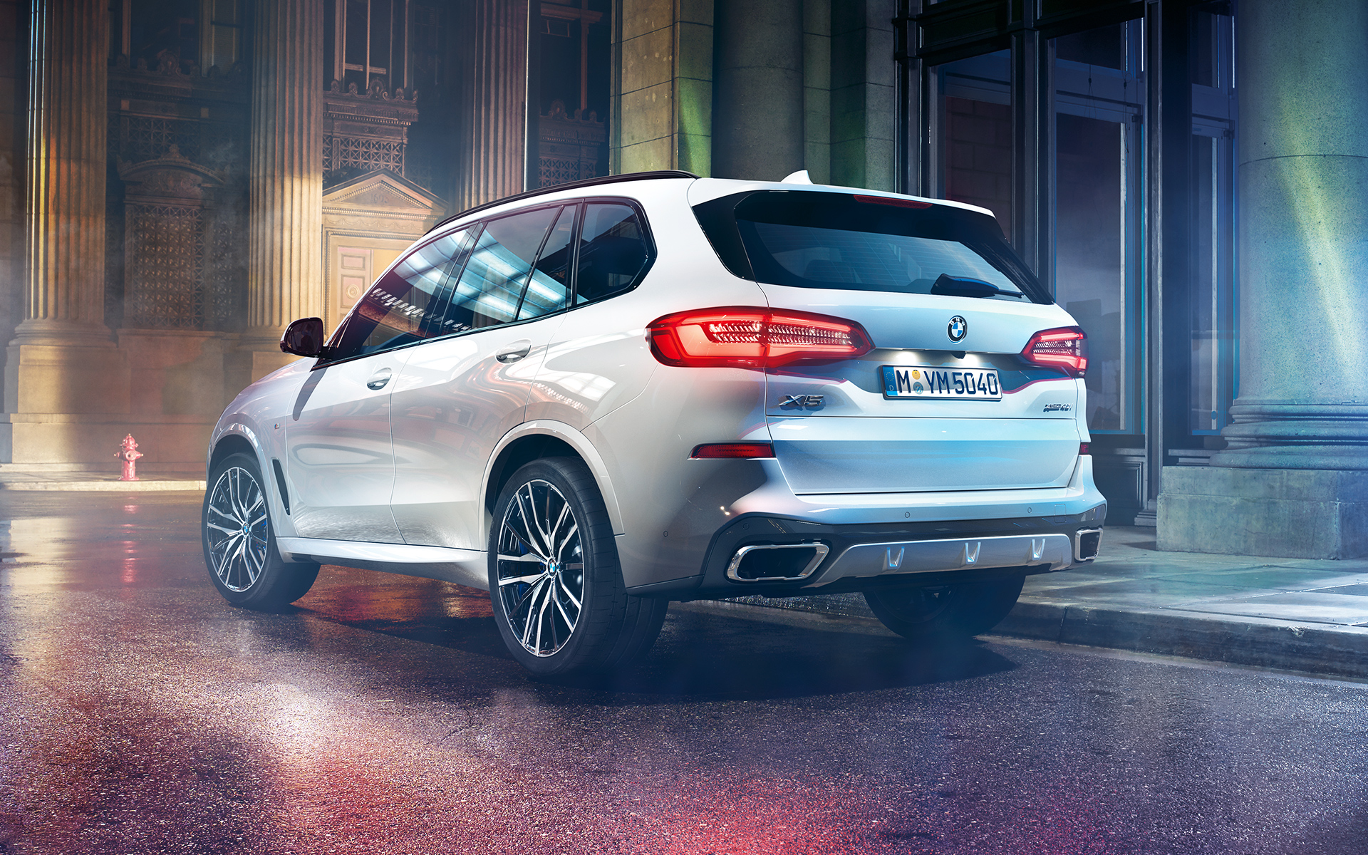 Rear shot of the BMW X5 at night in an urban setting