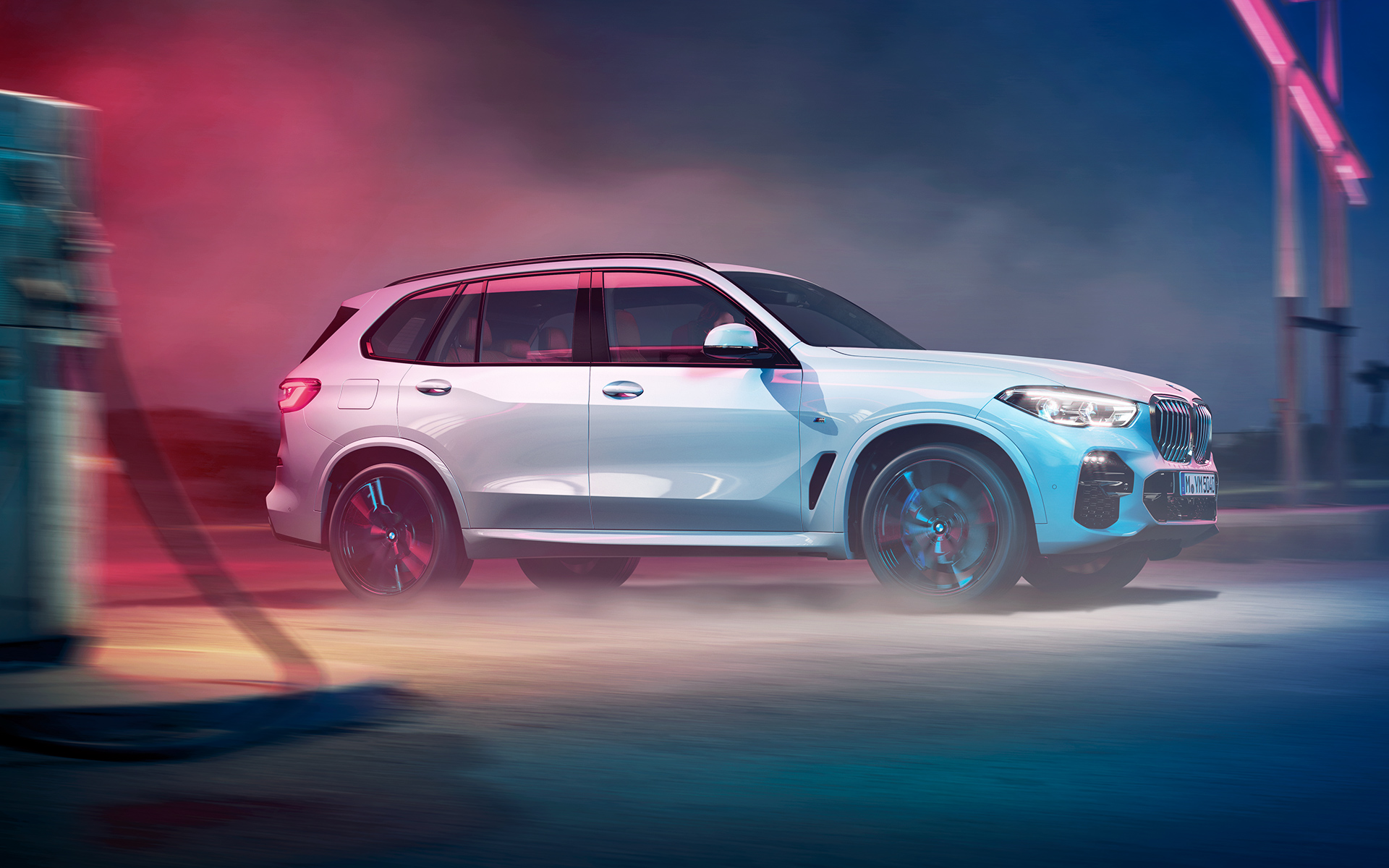 The silhouette of the BMW X5 at night in an urban setting