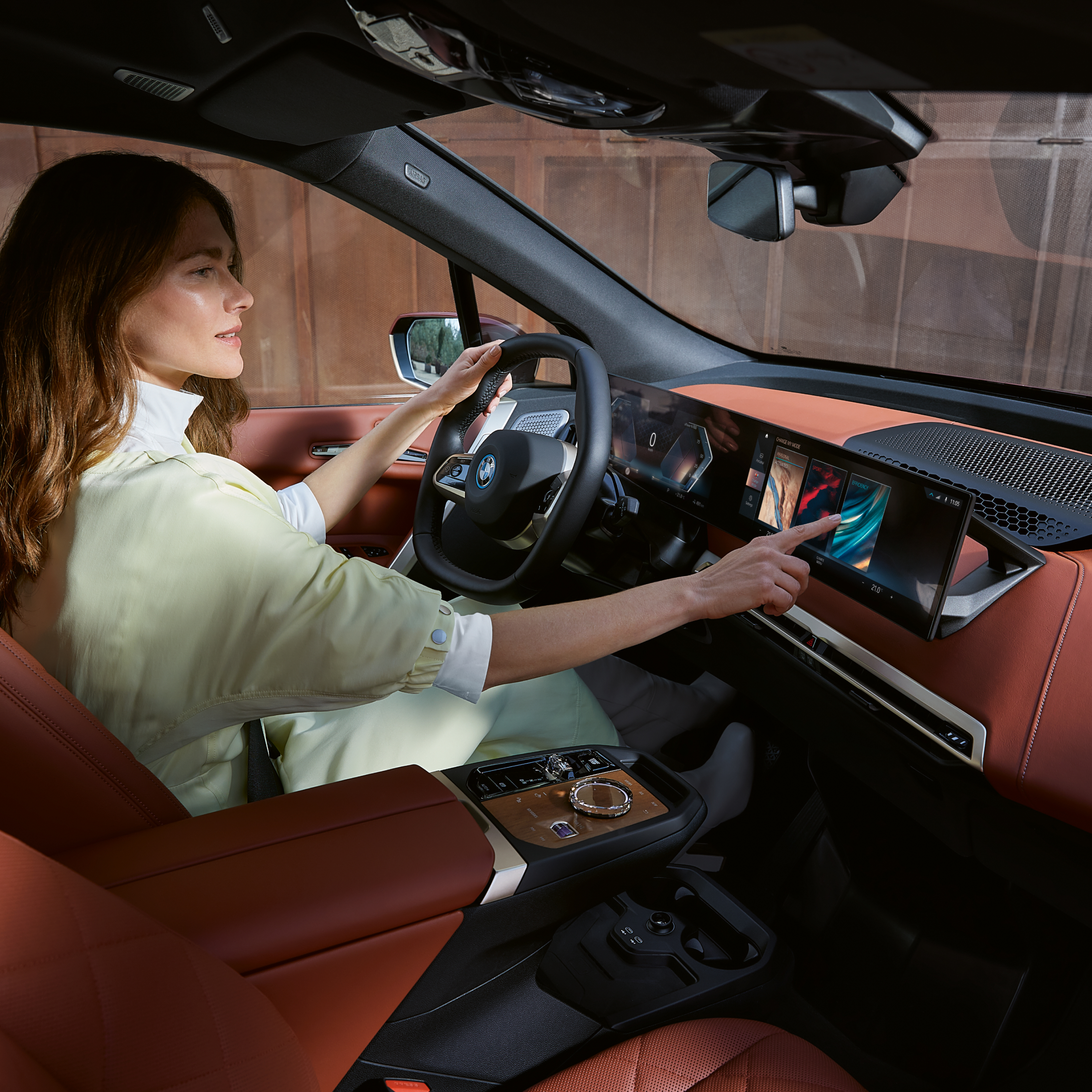 Person on driver’s seat operates dashboard