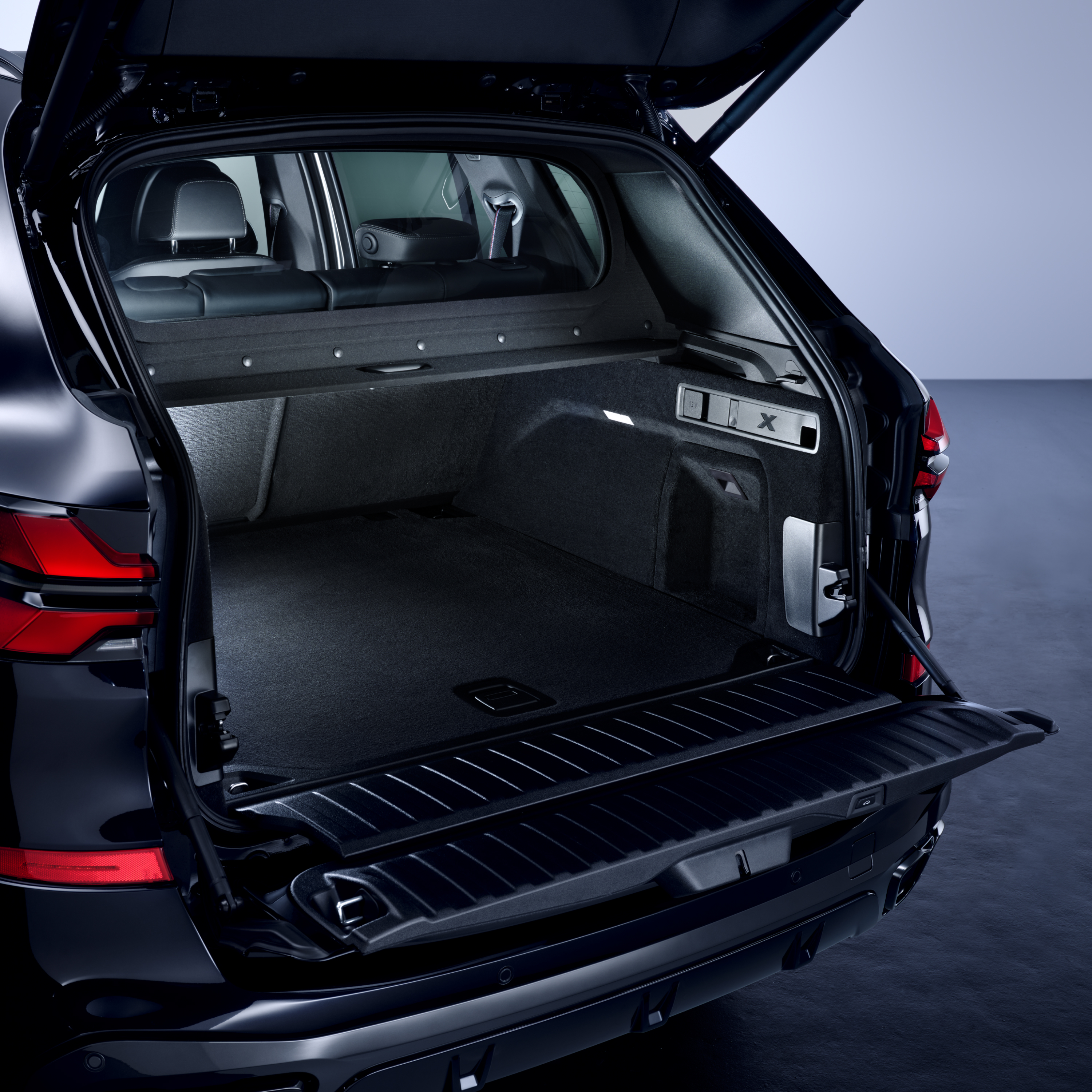 Close-up of the open tailgate of a BMW Protection Vehicle with a view into the passenger cell